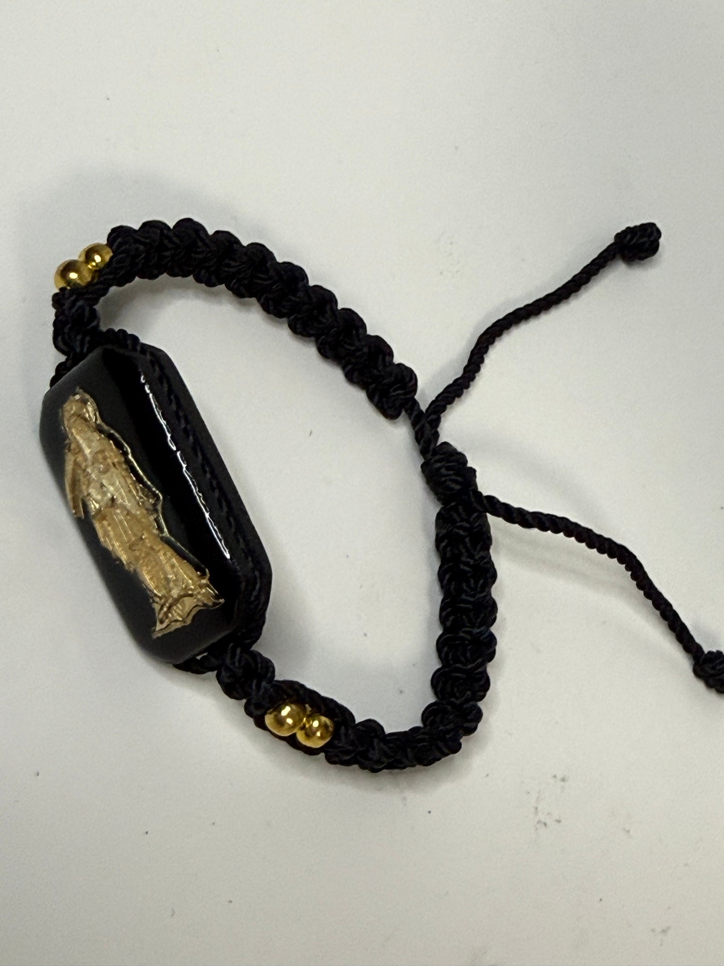 Pulsera De La Santa Muerte Tejida a Mano con (dorada) /Hand-woven Santa Muerte bracelet with (gold)