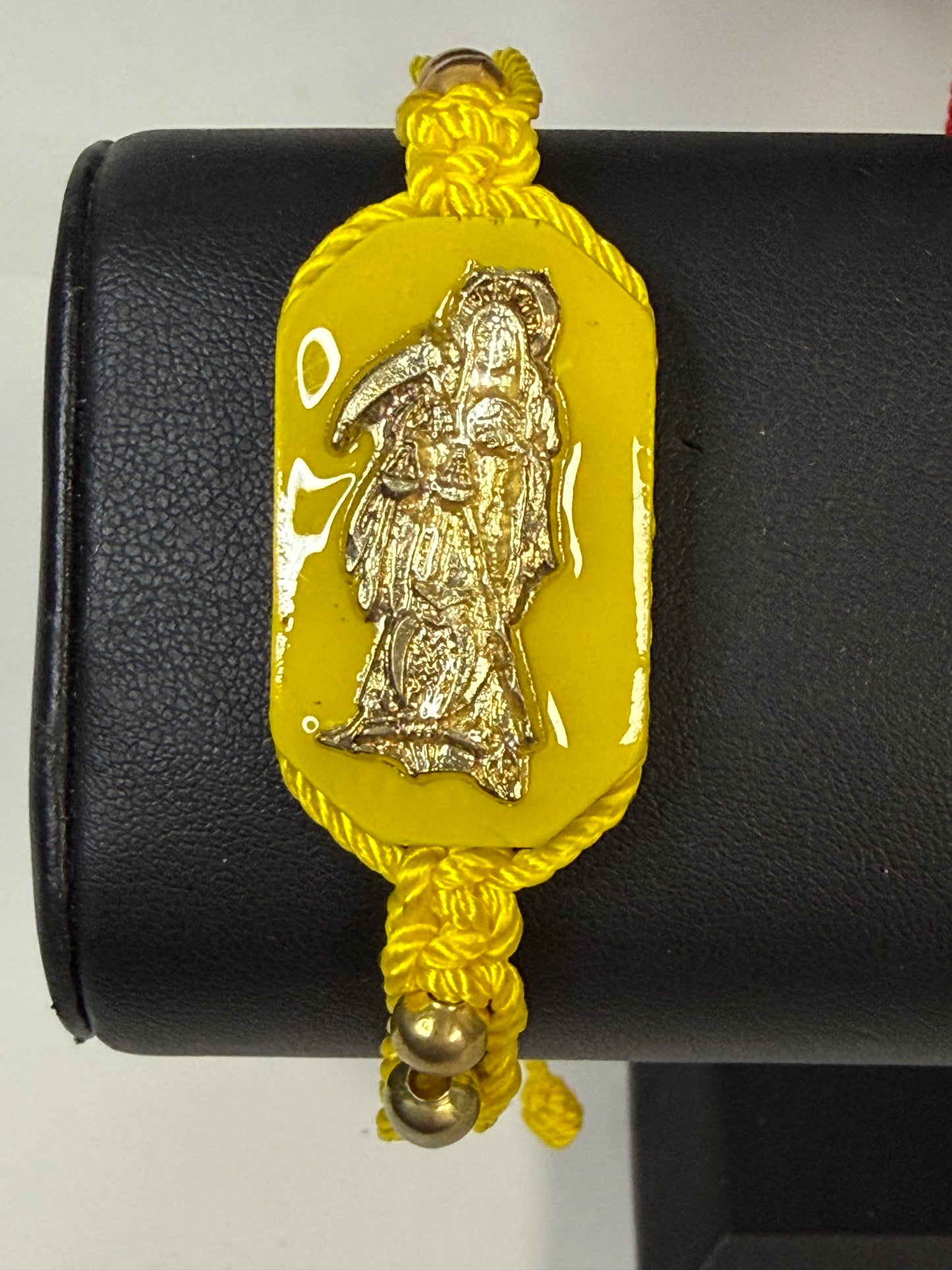 Pulsera De La Santa Muerte Tejida a Mano con (dorada) /Hand-woven Santa Muerte bracelet with (gold)