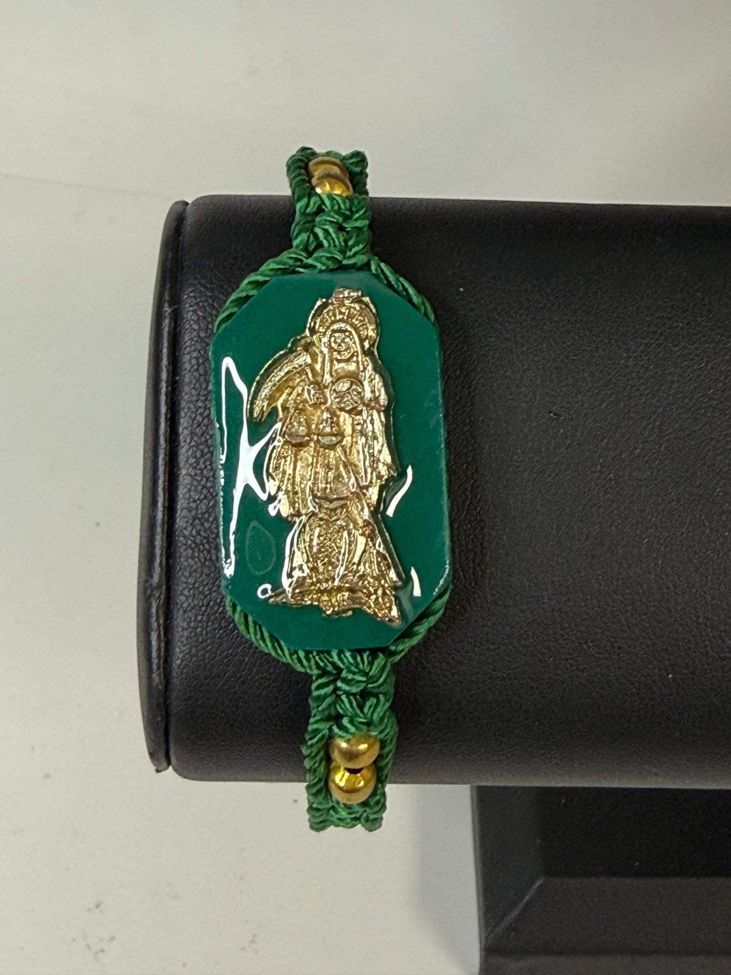 Pulsera De La Santa Muerte Tejida a Mano con (dorada) /Hand-woven Santa Muerte bracelet with (gold)