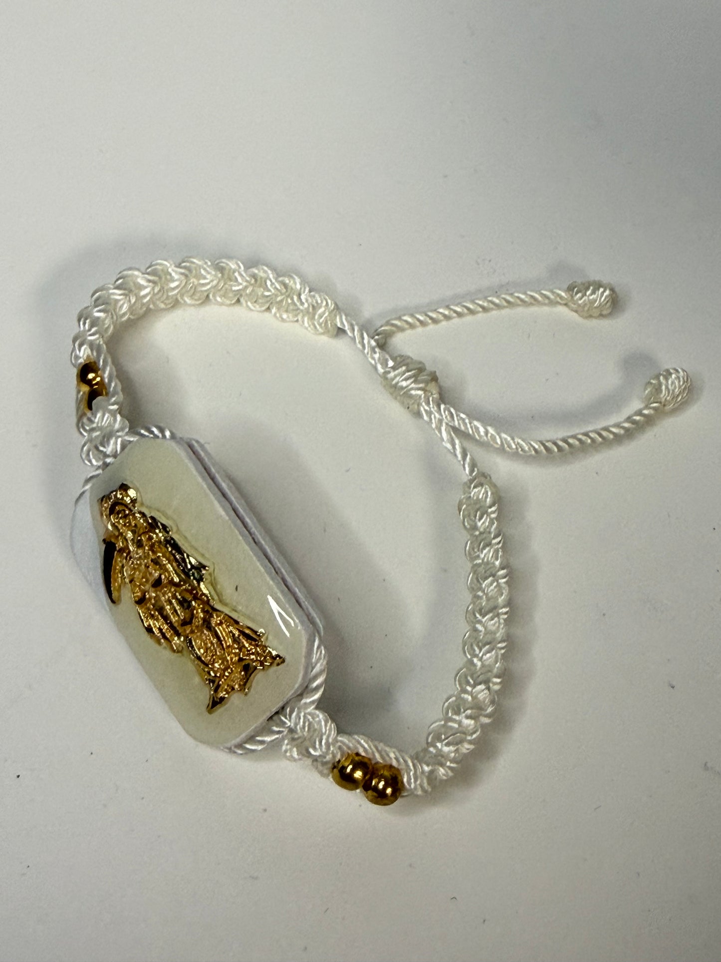 Pulsera De La Santa Muerte Tejida a Mano con (dorada) /Hand-woven Santa Muerte bracelet with (gold)
