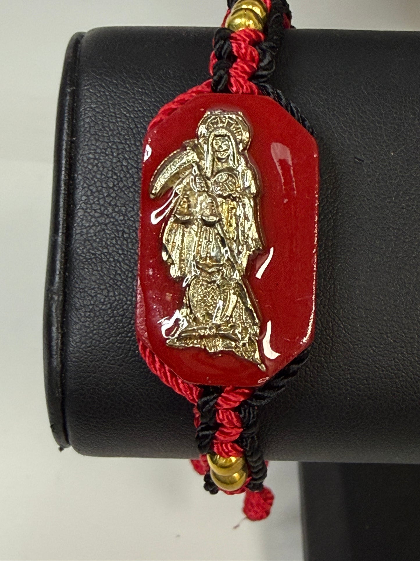 Pulsera De La Santa Muerte Tejida a Mano con (dorada) /Hand-woven Santa Muerte bracelet with (gold)