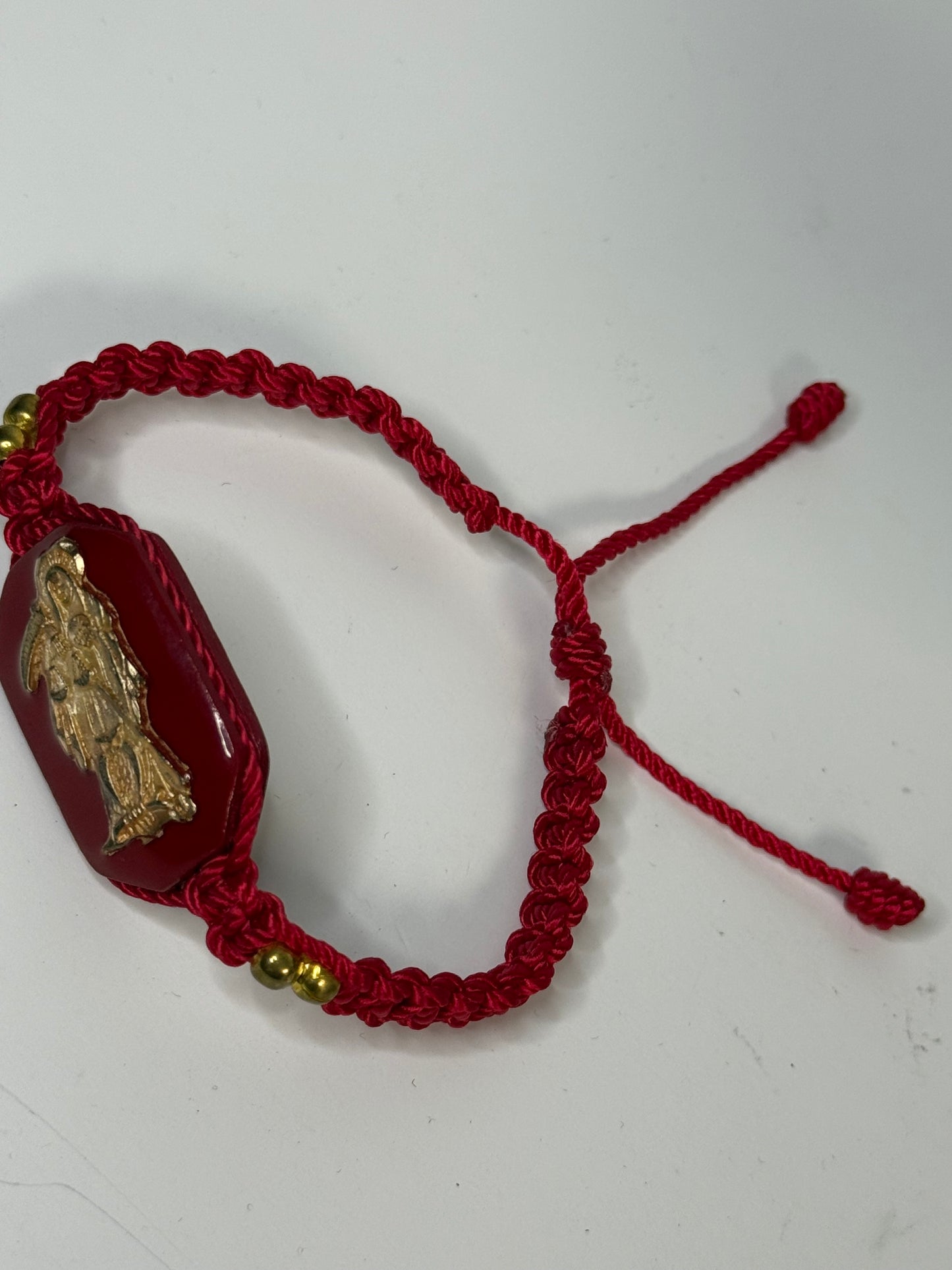 Pulsera De La Santa Muerte Tejida a Mano con (dorada) /Hand-woven Santa Muerte bracelet with (gold)