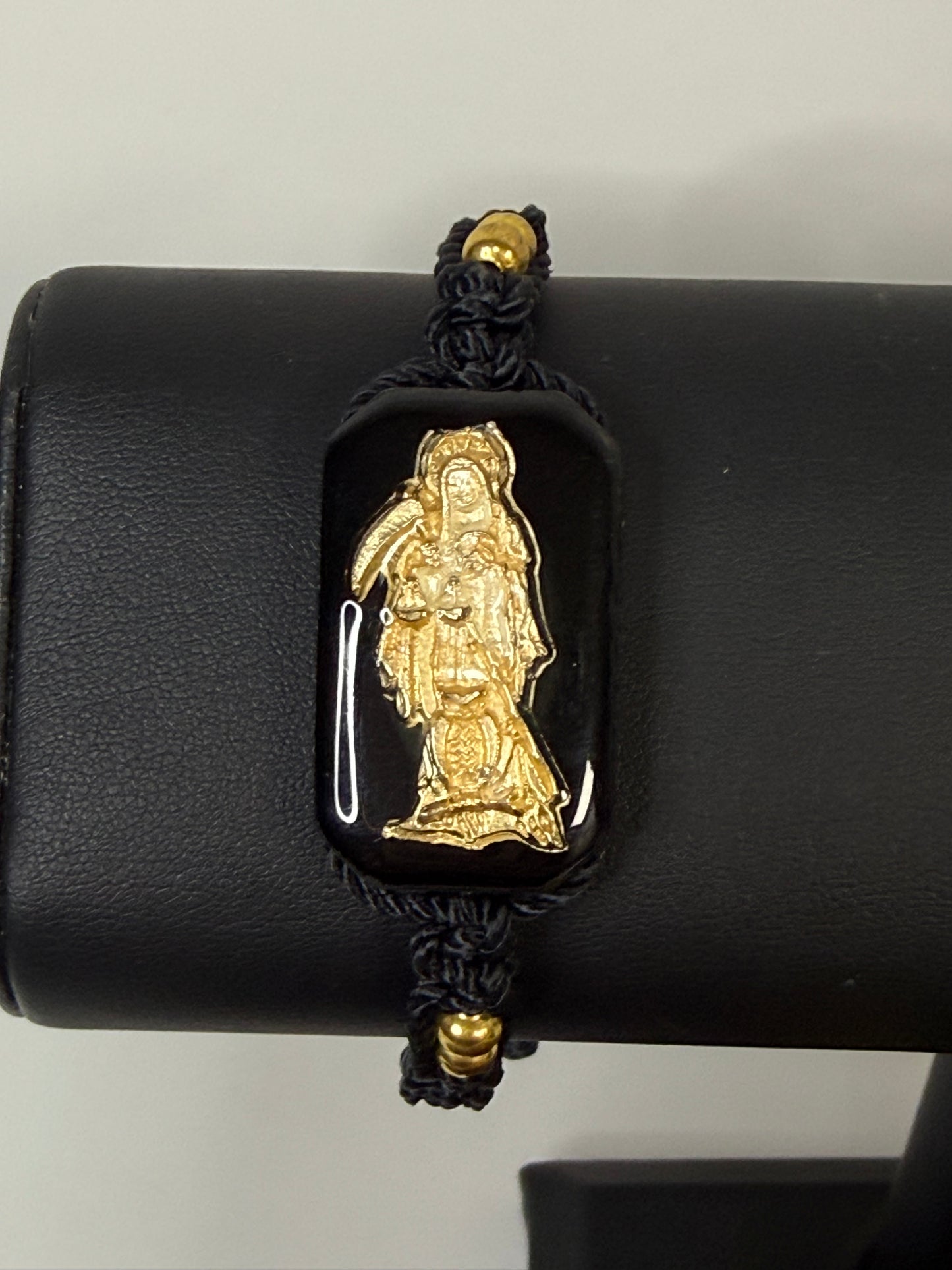 Pulsera De La Santa Muerte Tejida a Mano con (dorada) /Hand-woven Santa Muerte bracelet with (gold)