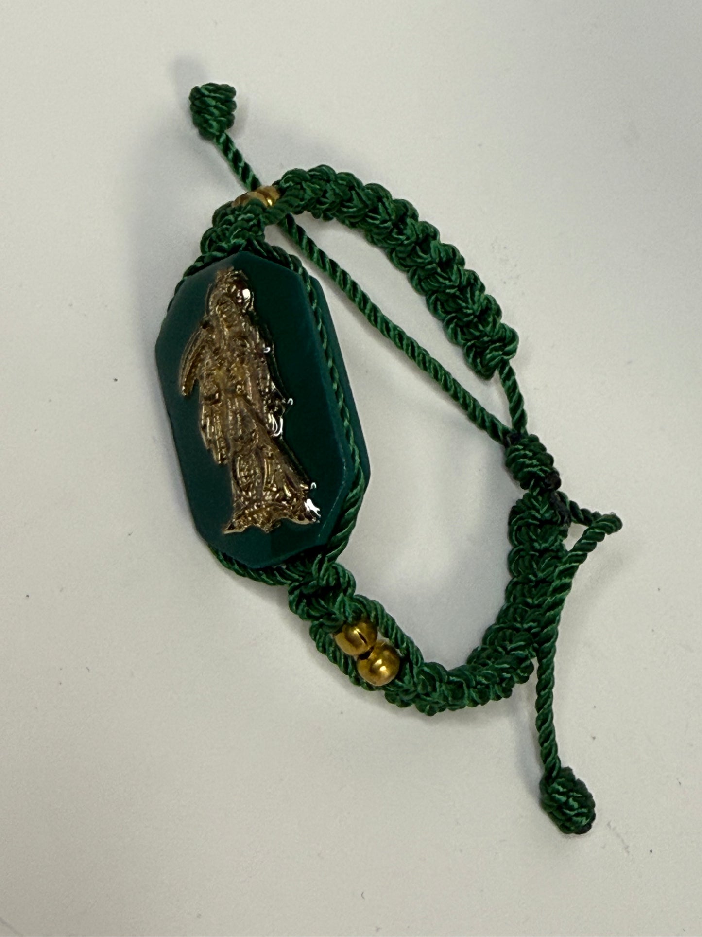 Pulsera De La Santa Muerte Tejida a Mano con (dorada) /Hand-woven Santa Muerte bracelet with (gold)