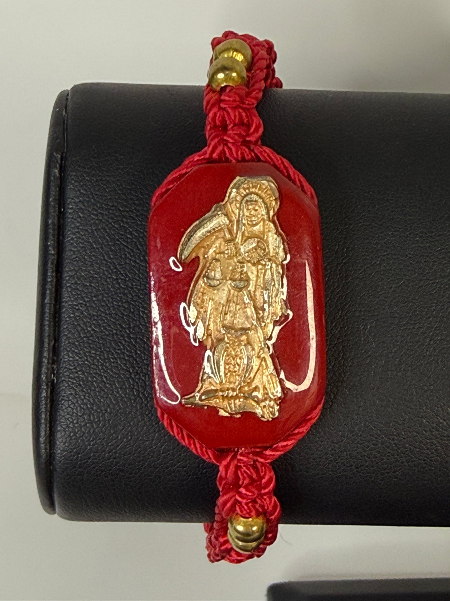 Pulsera De La Santa Muerte Tejida a Mano con (dorada) /Hand-woven Santa Muerte bracelet with (gold)
