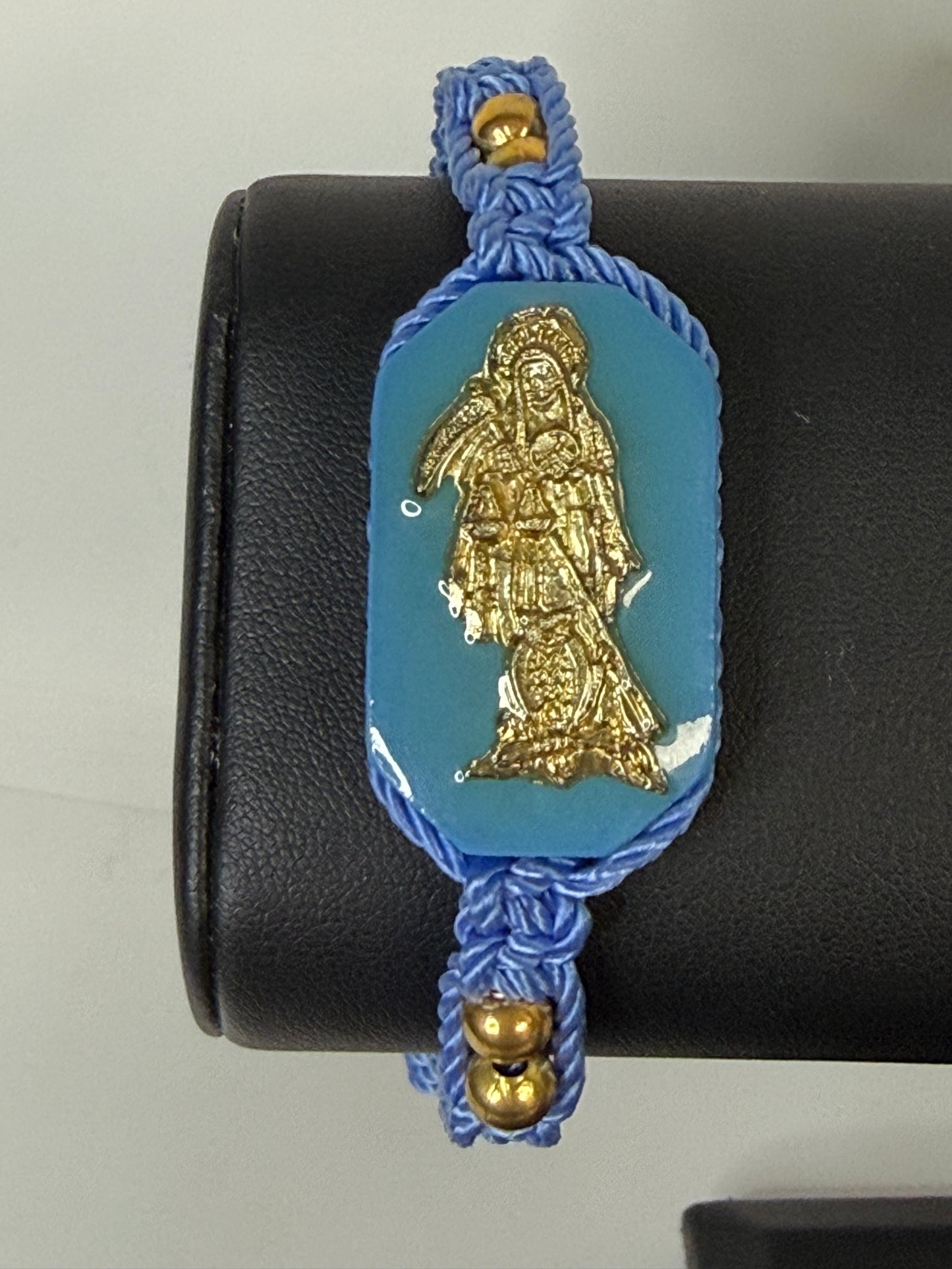 Pulsera De La Santa Muerte Tejida a Mano con (dorada) /Hand-woven Santa Muerte bracelet with (gold)